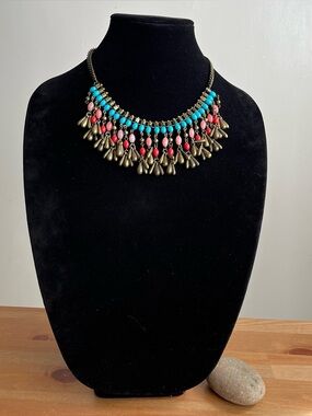 Antique-style brass beaded statement necklace with boho-style dangling charms